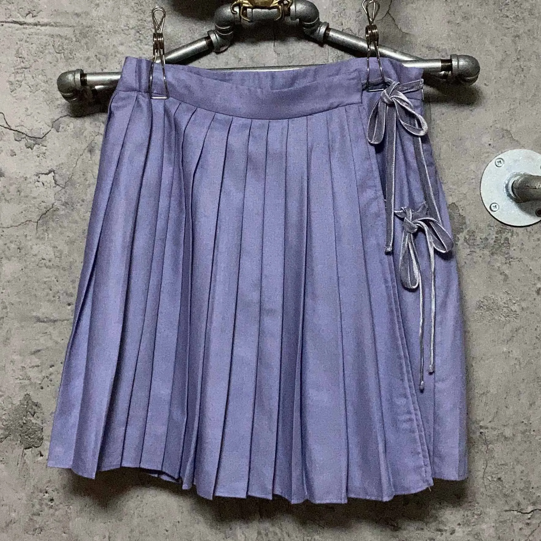 purple pleated skirt